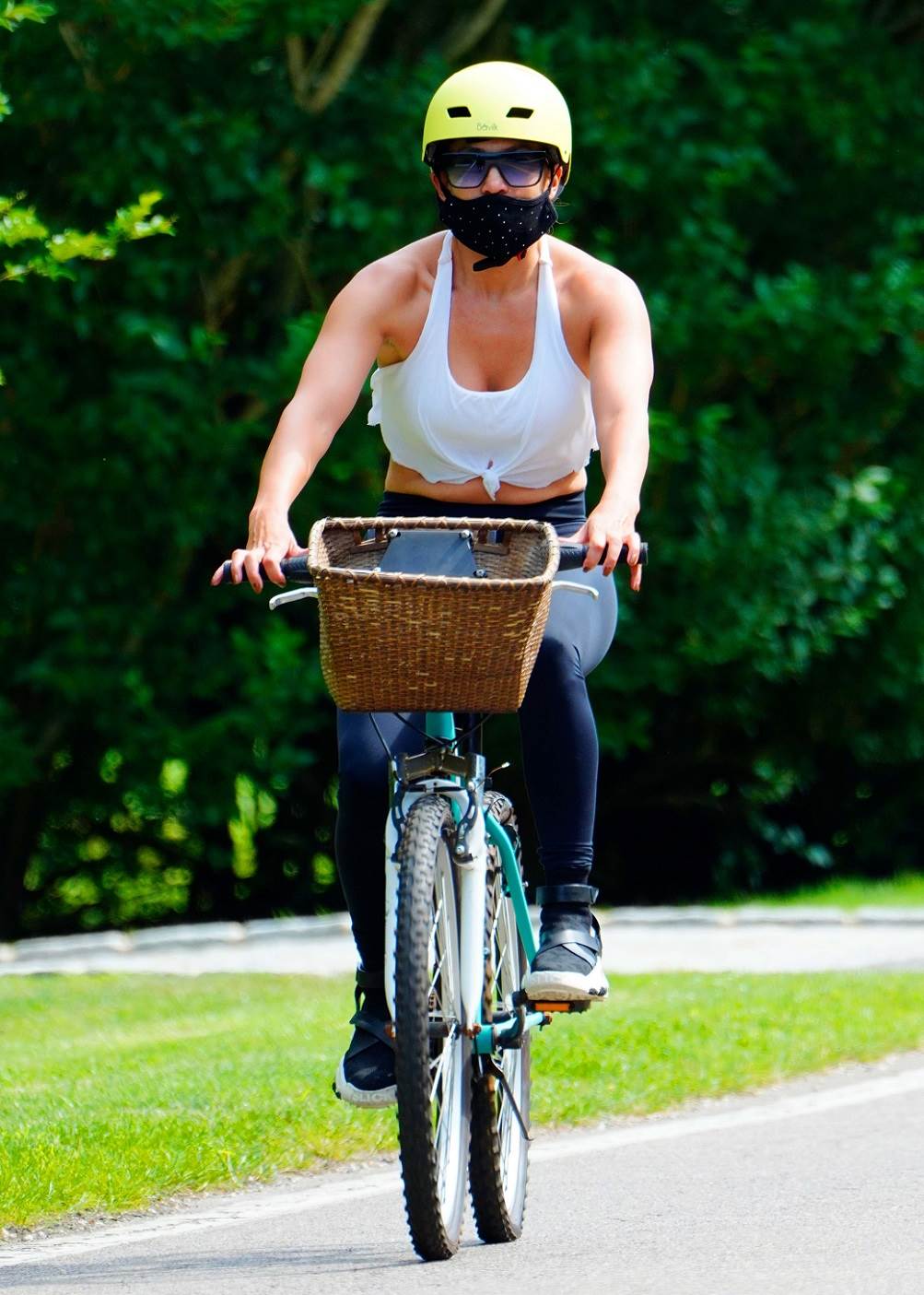  07/23/2020 Jennifer Lopez is pictured on a bike ride with a trainer ahead of her 51st birthday in The Hamptons. The pop star and actress wore a neon helmet, patterned face mask, cropped tank top, black leggings, and matching trainers.,Image: 546523374, License: Rights-managed, Restrictions: NO usage without agreed price and terms. Please contact sales@theimagedirect.com, Model Release: no, Credit line: TheImageDirect.com / The Image Direct / Profimedia 