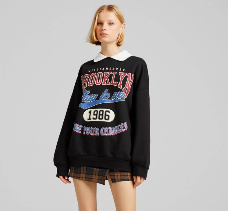 Bershka duks sa kragnom i printom je super ideja za svakodnevne kombinacije.